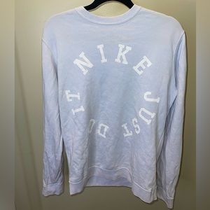 Nike crew neck sweatshirt. Light blue w/white distressing.